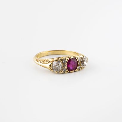 null Pretty yellow gold ring (750) centered on an oval synthetic ruby in a semi-closed...