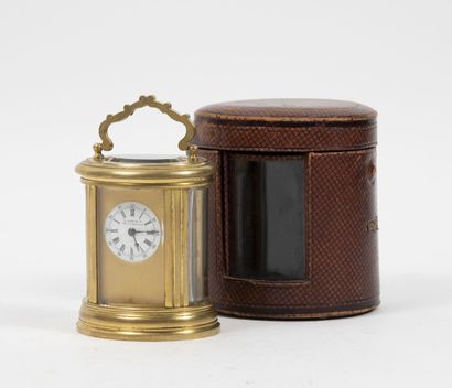 LEROY & Cie Small travel clock of oval form.
Cage in glass and gilded brass of elliptic...