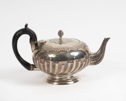 Charles Stuart HARRIS Small silver teapot (925) on molded pedestal, the body decorated...
