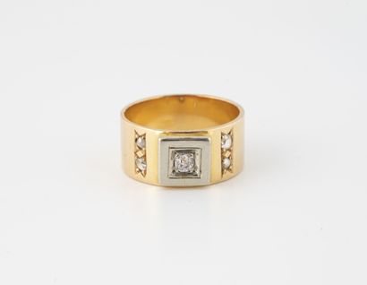 null Yellow and white gold (750) ring centered on an old-cut diamond in a seed setting,...