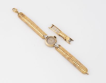 OMEGA Ladies' wristwatch in yellow gold (750) and platinum (850). 
Round case, the...