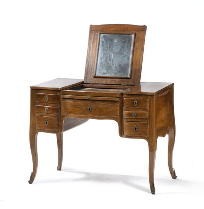 Dressing table.
In natural wood and walnut,...