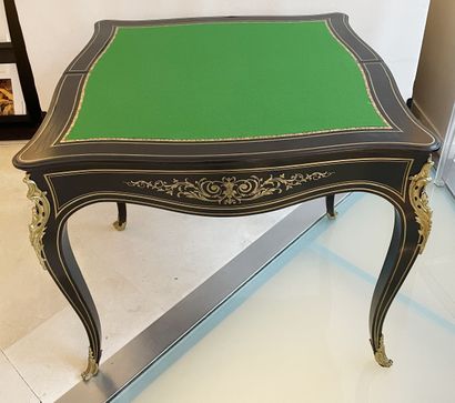 null Game table in blackened wood veneer decorated with scrolls and brass fillets....