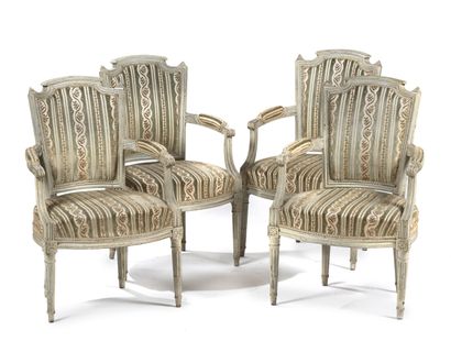 null Suite of four armchairs in cabriolet.
In molded wood, carved, cream lacquered,...