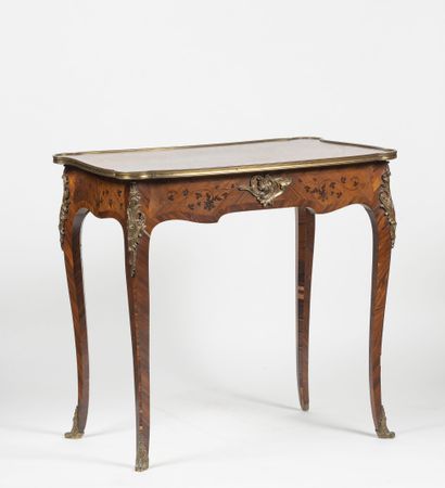 A small writing table with a rosewood veneer...
