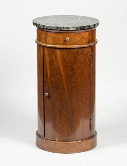null Mahogany veneered cylindrical chest of drawers opening with a door and a drawer...