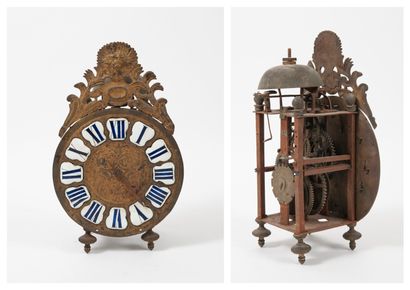 XVIIIème-XIXème siècles. Lantern clock with iron frame and brass wheels, resting...