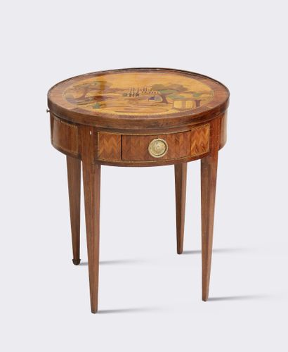 null Circular table bouillotte in exotic wood veneer with plain or herringbone decoration...