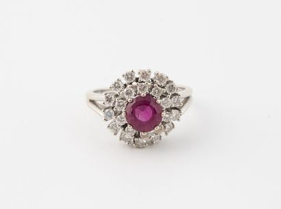 null White gold (750) ring centered on a round faceted tourmaline (rubelite) in a...