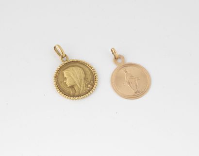 null Two religious medals in the effigy of the Virgin, engraved on the reverse side...