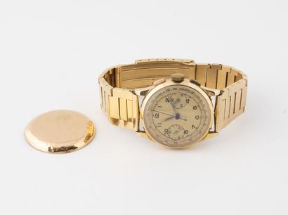 null Montre chronographe bracelet d'homme. 
Boitier rond en or jaune (750). 
Cadran...