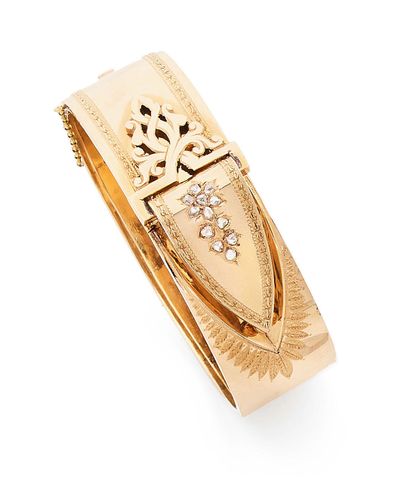 null Rigid ribbon bracelet in yellow gold (750), with a motif simulating a belt buckle...