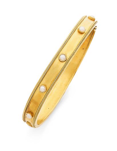 null Bracelet jonc ouvrant en or jaune (750) amati à bordure de filin torsadé, et...