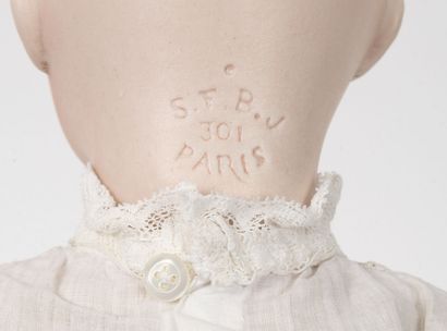 SFBJ Doll, the porcelain head marked in hollow " SFBJ 301 Paris", size 6 blue eyes,...