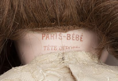 PARIS BEBE Doll with porcelain head marked with red stamp "PARIS-BEBE Tête déposée...