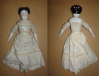 Parian type doll
Fixed head with collar and...