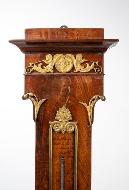 null Barometer thermometer in mahogany veneer and gilded bronze trim decorated with...