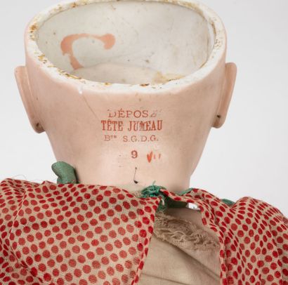JUMEAU Doll, the head in porcelain closed mouth, fixed blue eyes, marked with the...