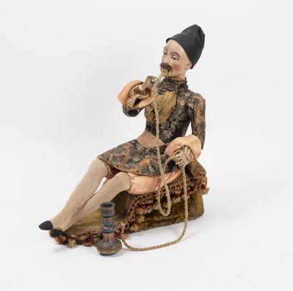 The smoker of hookah.
Seated automaton with...