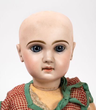 JUMEAU Doll, the head in porcelain closed mouth, fixed blue eyes, marked with the...
