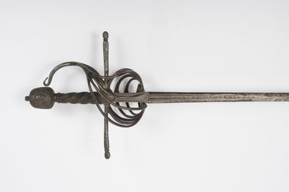null Iron rapier.
Guard in cage with many branches meeting in chiselled hook, with...