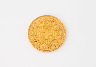 SUISSE 1 pièce de 20 francs or, 1935.
Poids : 6,4 g.
Rayures et usures.
