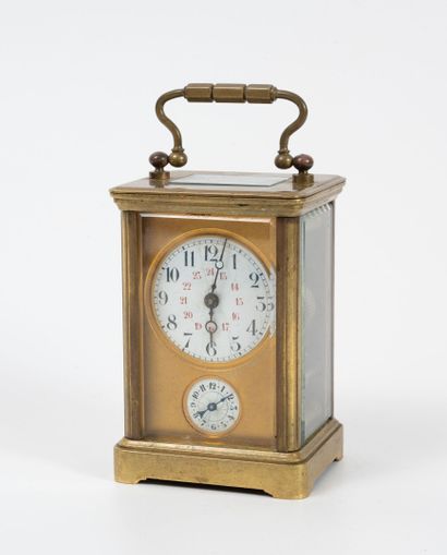null Gilded brass officer's clock. 
Rectangular glass cage and beveled, stepped cornice,...