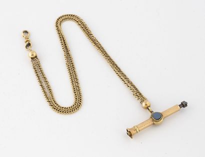 null Yellow gold (750) watch chain holding a yellow and pink gold (750) winding key...