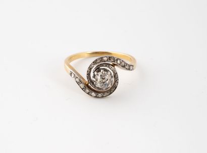 null Yellow gold (750) tourbillon ring centered on an old-cut diamond surrounded...