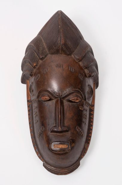 CÔTE d'IVOIRE, Baoulé, première moitié du XXème siècle. Masque en bois sculpté.
H....