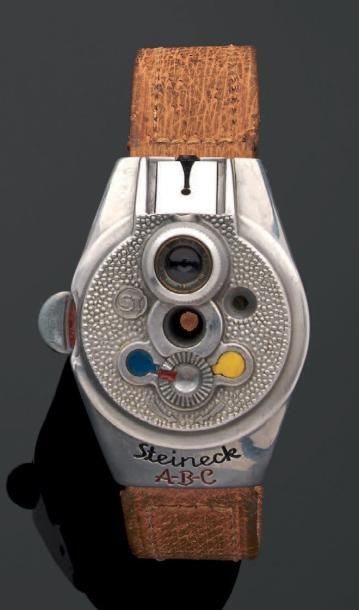 STEINECK A-B-C Appareil photographique en forme de montre bracelet en métal. Bracelet...