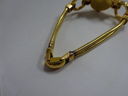 null Montre bracelet de dame en or jaune (750), cadran rond épaulé de pierres rouges,...