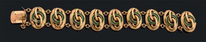 null Bracelet articulé en or jaune (750) composé de neuf médaillons ajourés ovales...