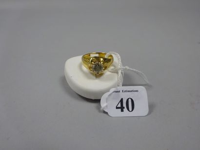 null Bague solitaire en or jaune (375) ornée d'un diamant demi-taille d'environ 1,00...