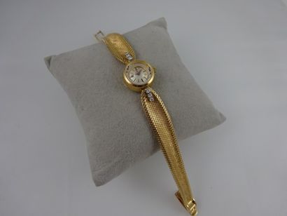 OMEGA Montre bracelet de dame en or jaune (750). 

Boitier rond en or jaune (750)...