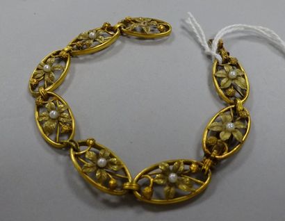 null Bracelet en or jaune et or rose à maillons ovales à motifs de fleurs ajourés...