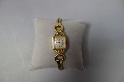 ELIAS Montre bracelet de dame en or jaune (750) le boîtier carré à épaulement anneaux...