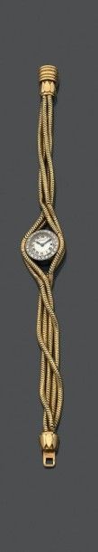 CARTIER Montre bracelet de dame en or (750) et platine (850), cadran rond argenté...