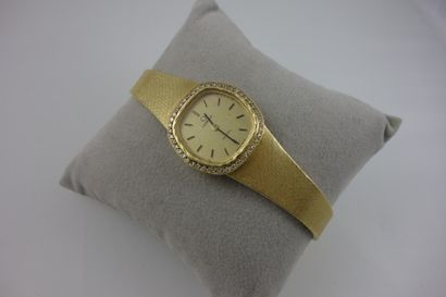 OMEGA Montre bracelet de dame en or jaune (750), cadran à fond doré et index bâtons...