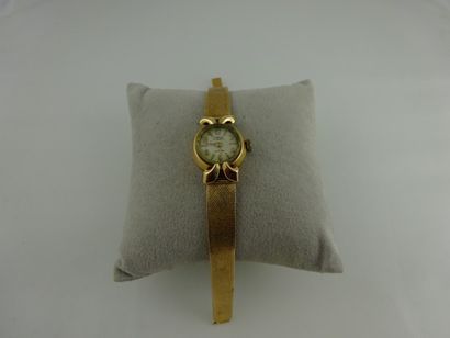 CORONA Montre bracelet de dame en or jaune (750). Boîtier rond, cadran à fond blanc,...