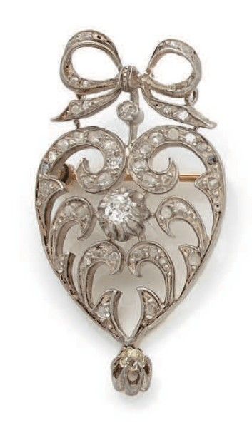 null Broche pendentif en or jaune (750) et argent (925) figurant un coeur stylisé...