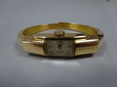 BUTEX 

Montre bracelet de dame en or jaune (750), bracelet rigide ouvrant.

Poids...