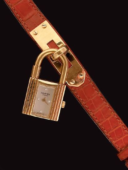 HERMES « KELLY n°095 » Montre bracelet de dame en or, boîtier cadenas, cadran argenté...