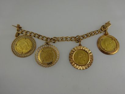 null Bracelet gourmette en or jaune (750) orné de 3 pièces de 20 Francs or (1859,...