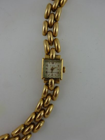 OLIMP Montre bracelet de dame en or jaune (750). 

Boitier carré, cadran à fond crème...