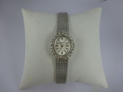 BERNEY BLONDEAU Montre bracelet de dame en or gris (750). Boîtier ovale, lunette...