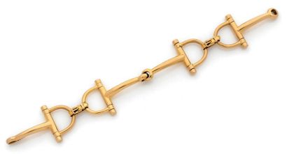 HERMES Paris, Mors 
Bracelet articulé en or jaune (750) formé de deux mors reliés...
