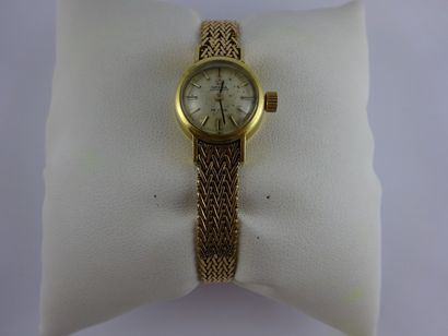 OMEGA DE VILLE Montre bracelet de dame, boîtier rond en or jaune (750).

Cadran à...