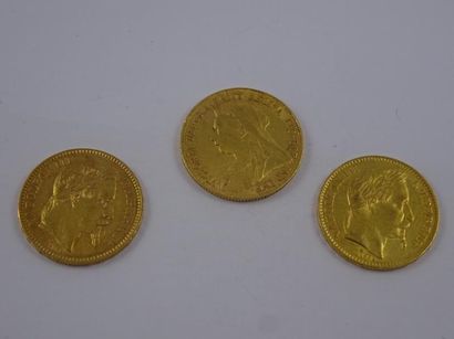 null Trois pièces en or comprenant : 

- une pièce de 20 Francs, 1862, Paris.

-...