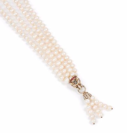null Sautoir formé de deux rangs de perles de culture blanches réunis par un mufle...